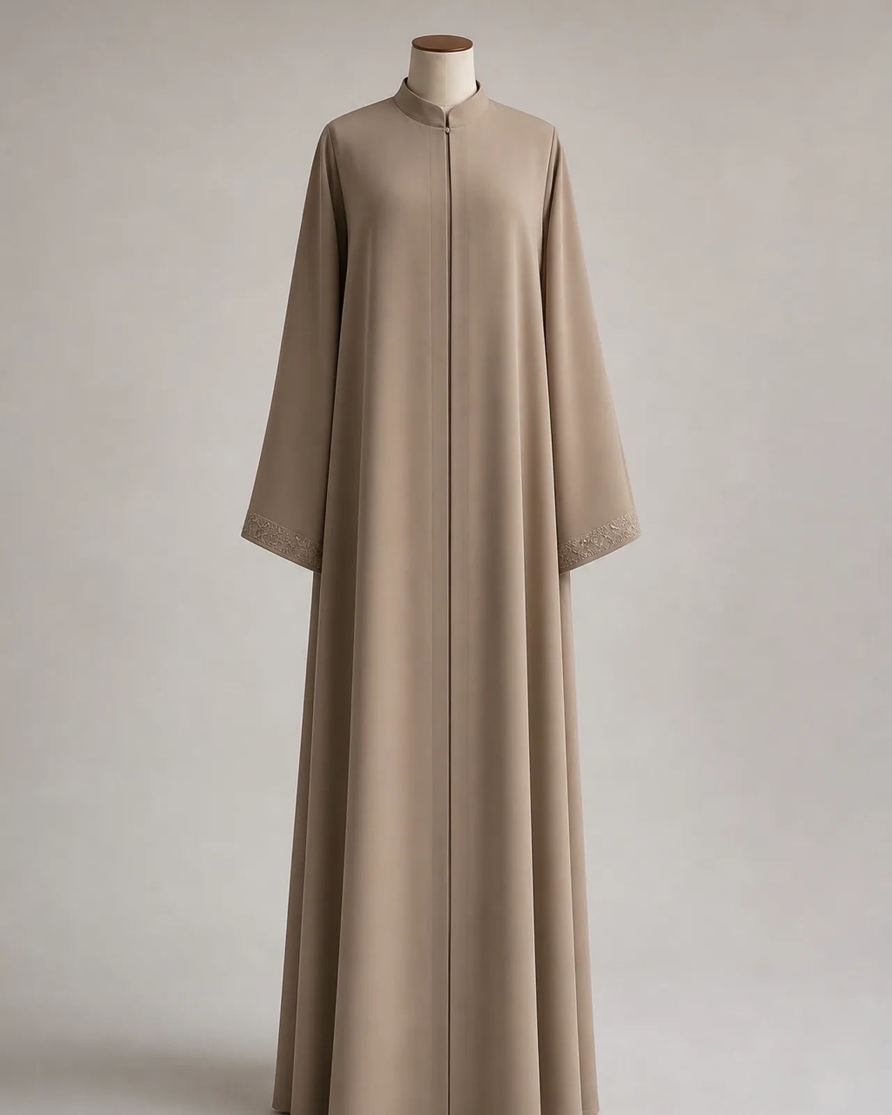 Front view, full length, closed abaya worn on its own, neckline closed and front panel flat, neutral studio background