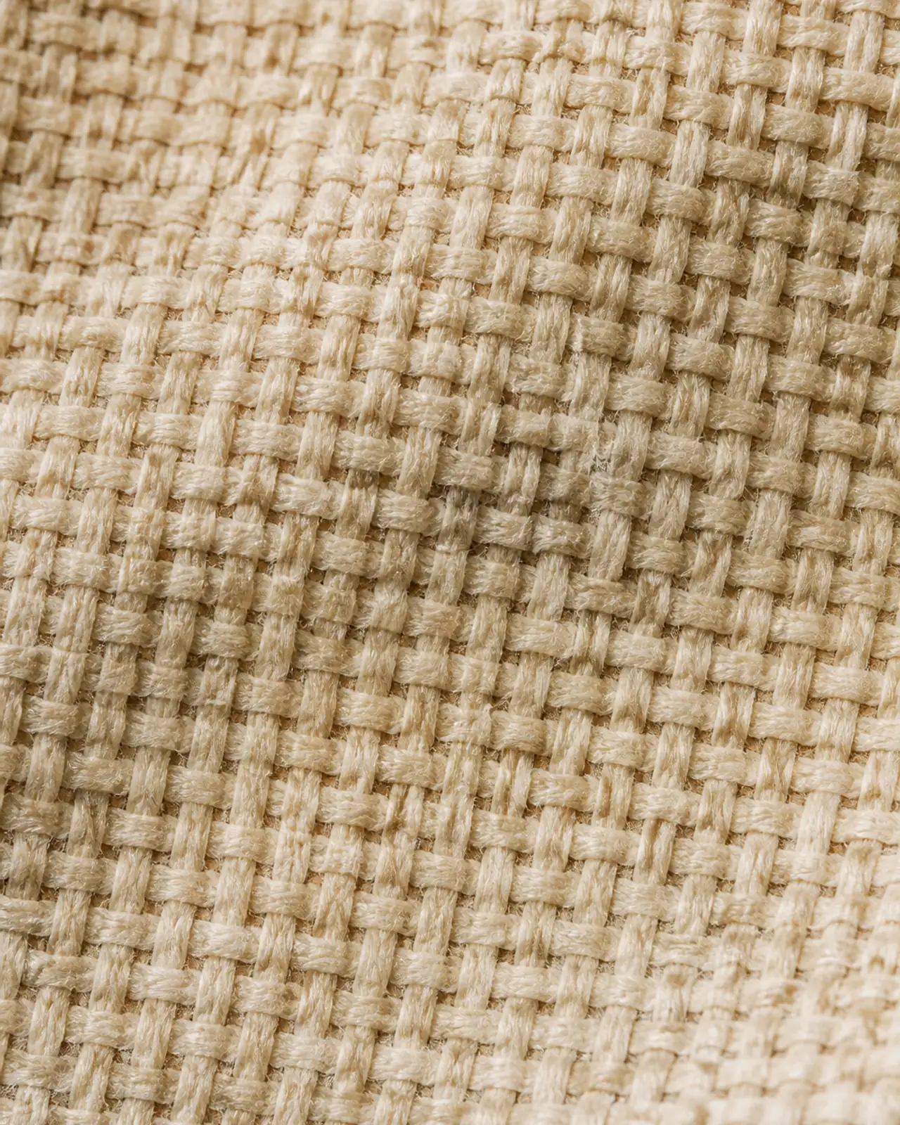 Fabric close-up at roughly three times magnification showing the knit or woven structure and its opacity