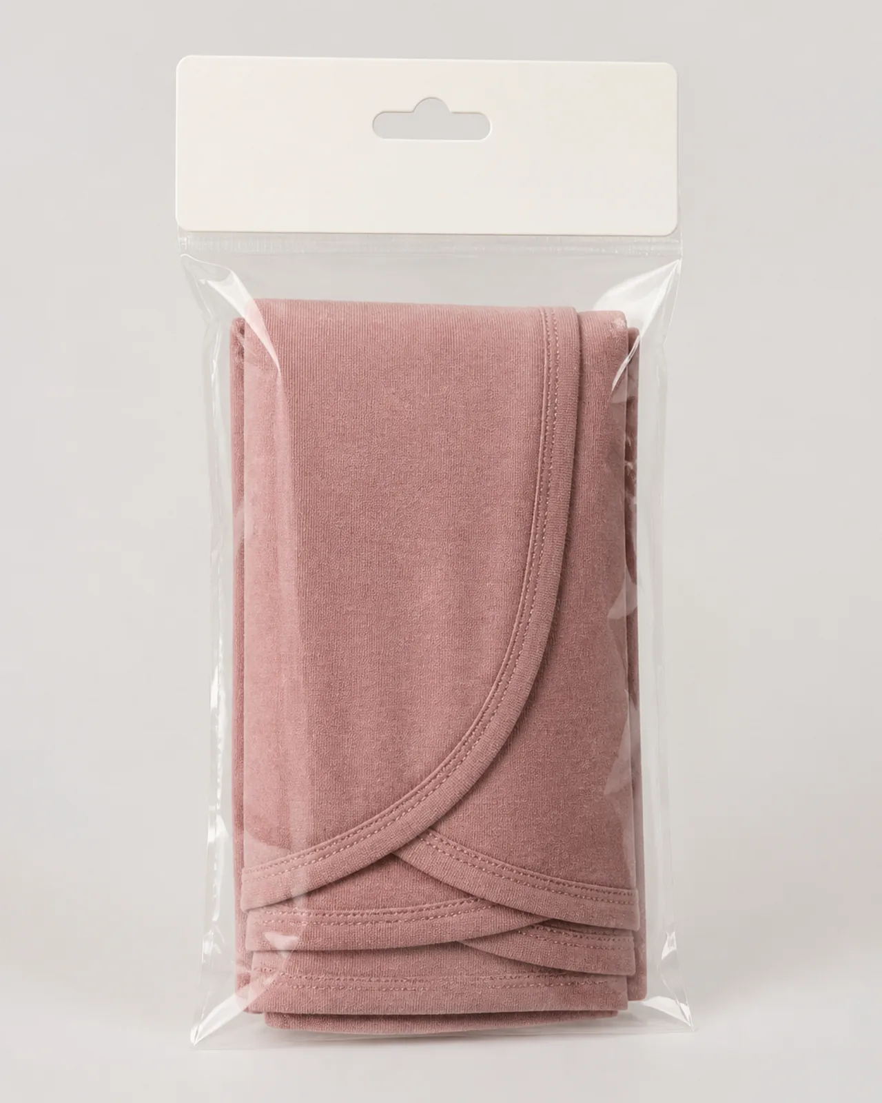 Retail packing: instant hijab folded with a header card in a poly bag, or hung on a display hanger with label visible