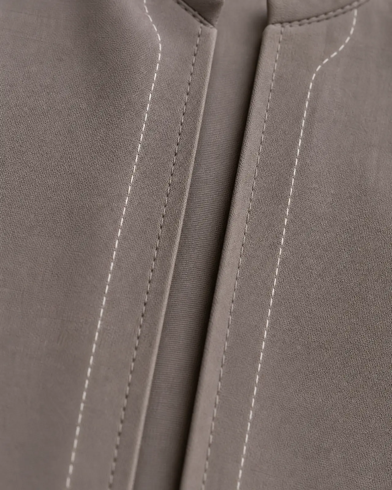 Front opening topstitch close-up along the placket edge, showing stitch line, pressed fold and where an optional embroidered border would sit