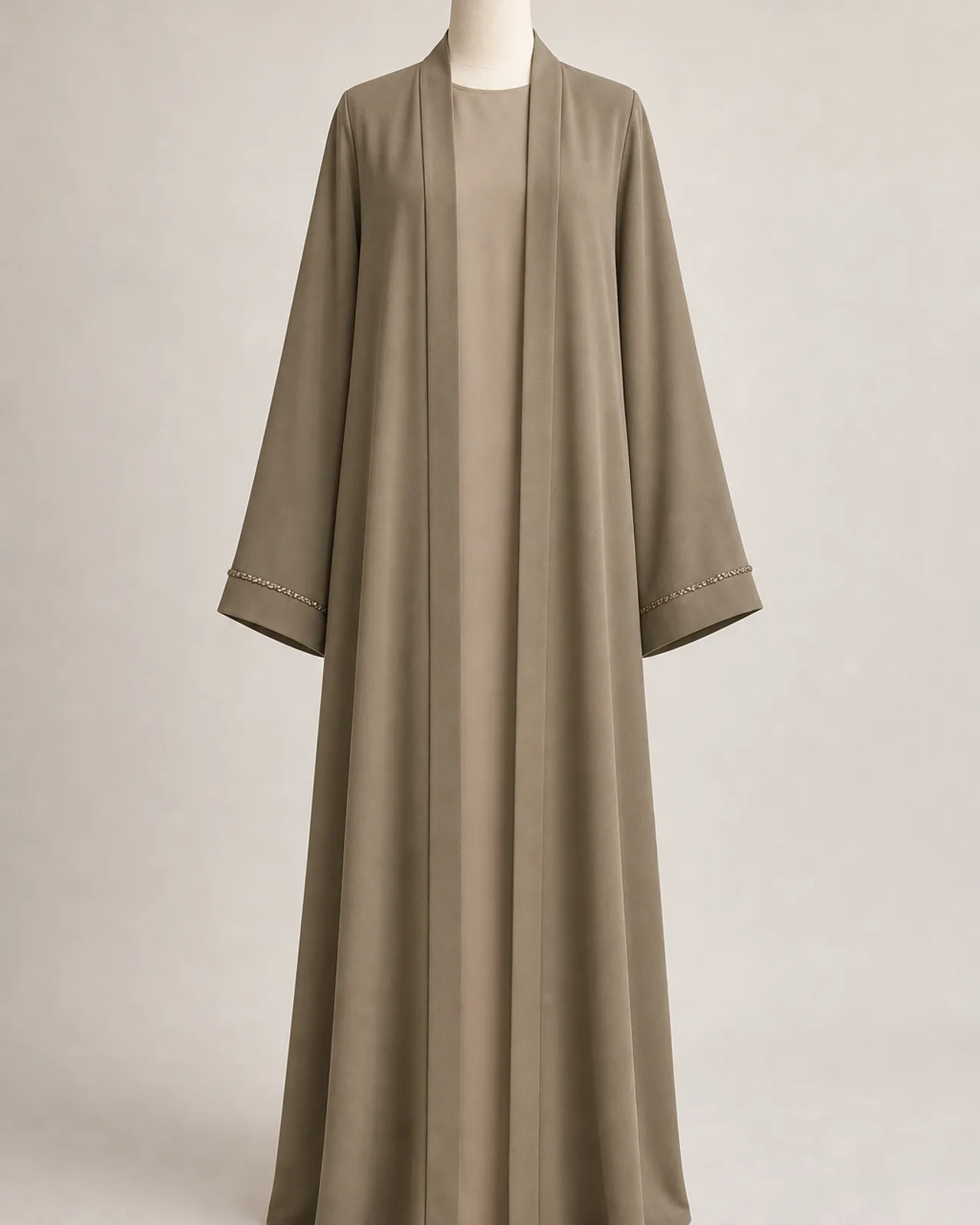 Front view, full length, open abaya worn over a plain inner dress, both front edges falling straight, ivory studio background